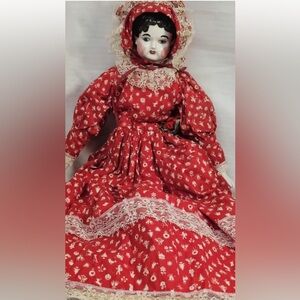 Vintage Red Porcelain Doll with Lace Details